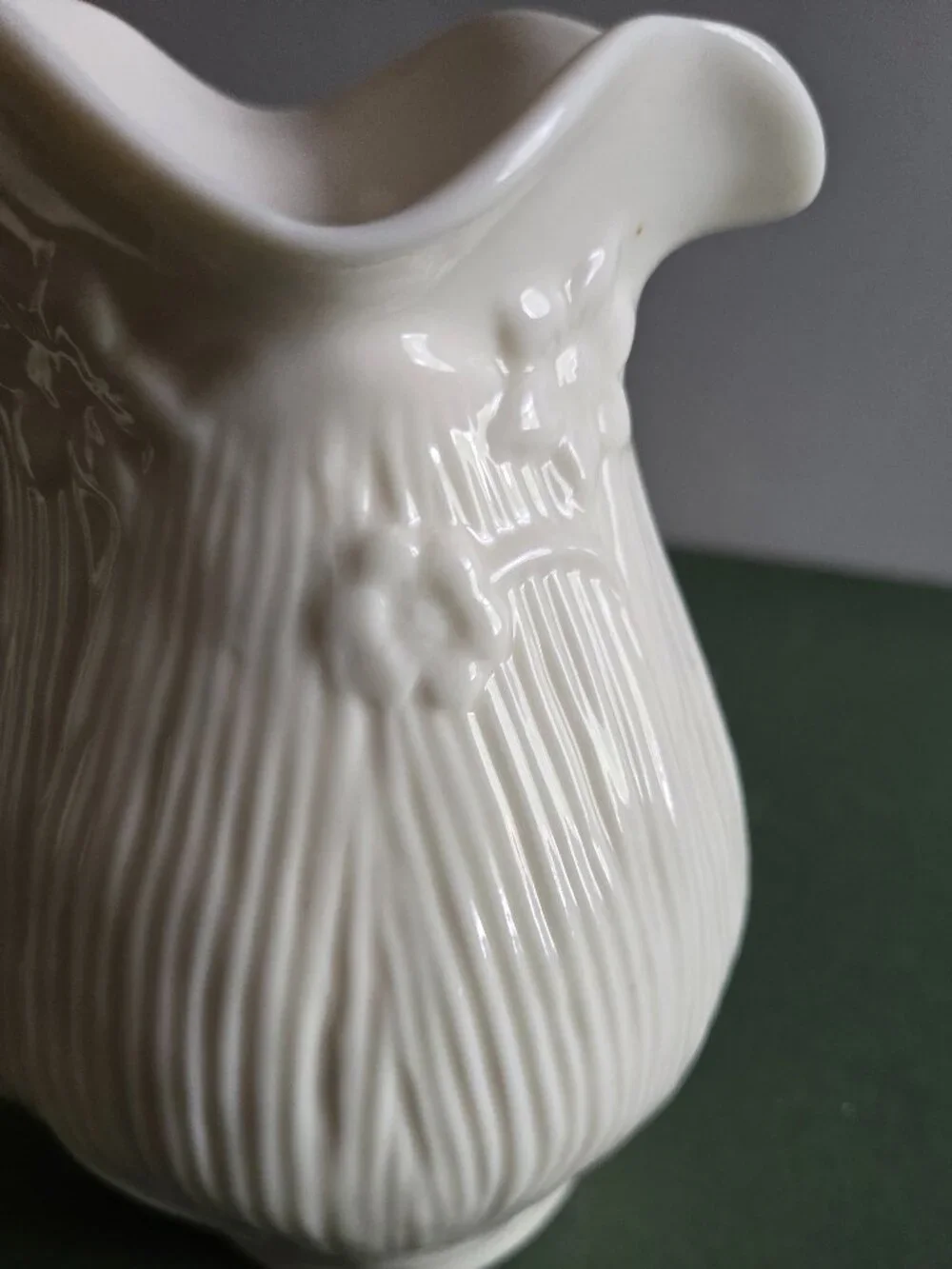Pair of Ivory Bisque Pitchers